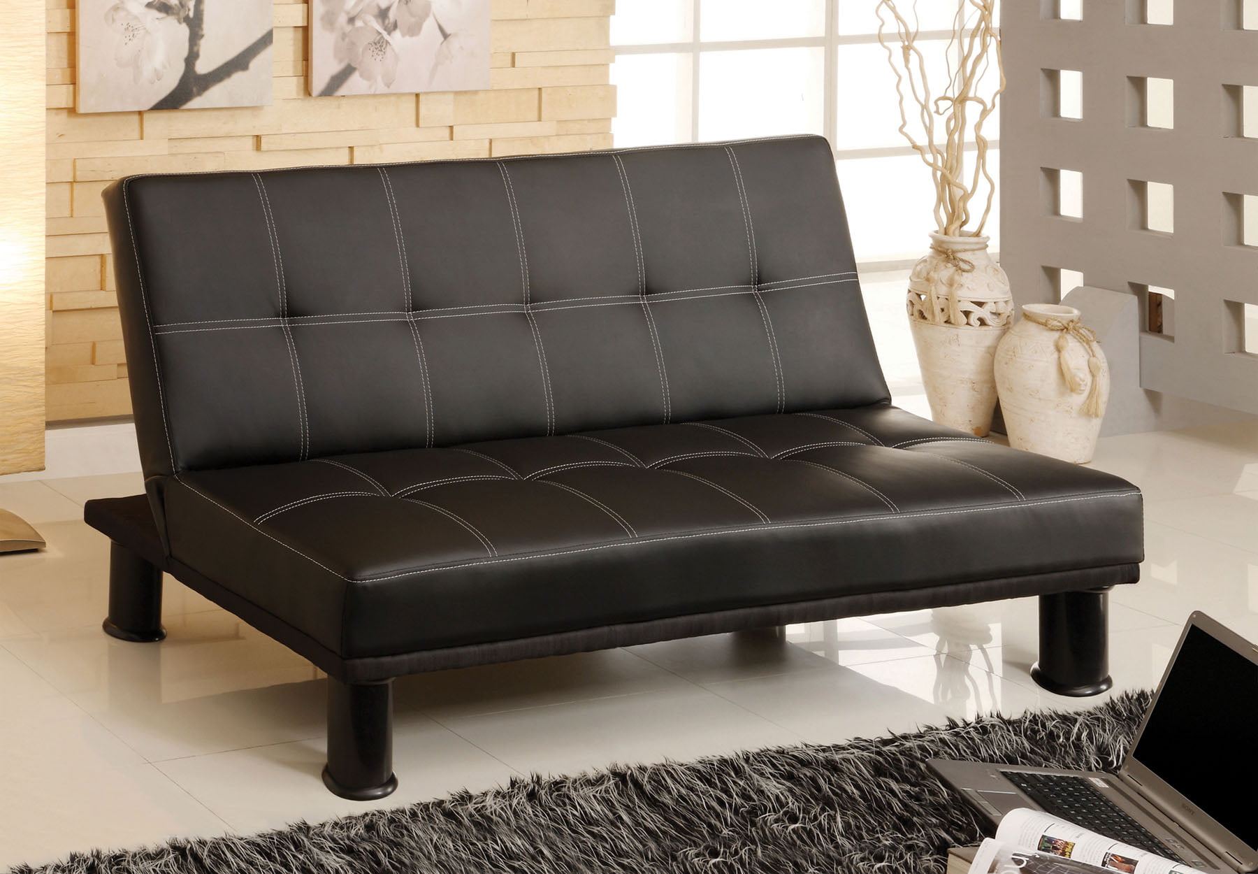 black leather sofa with bed