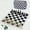 black and white, variant on DGZEOLOO Chess Set Portable Rollable Travel Game for Ages 14+, PU & ABS Pieces with Storage Bag, 1-Count, Exclusively for Teens & Adults