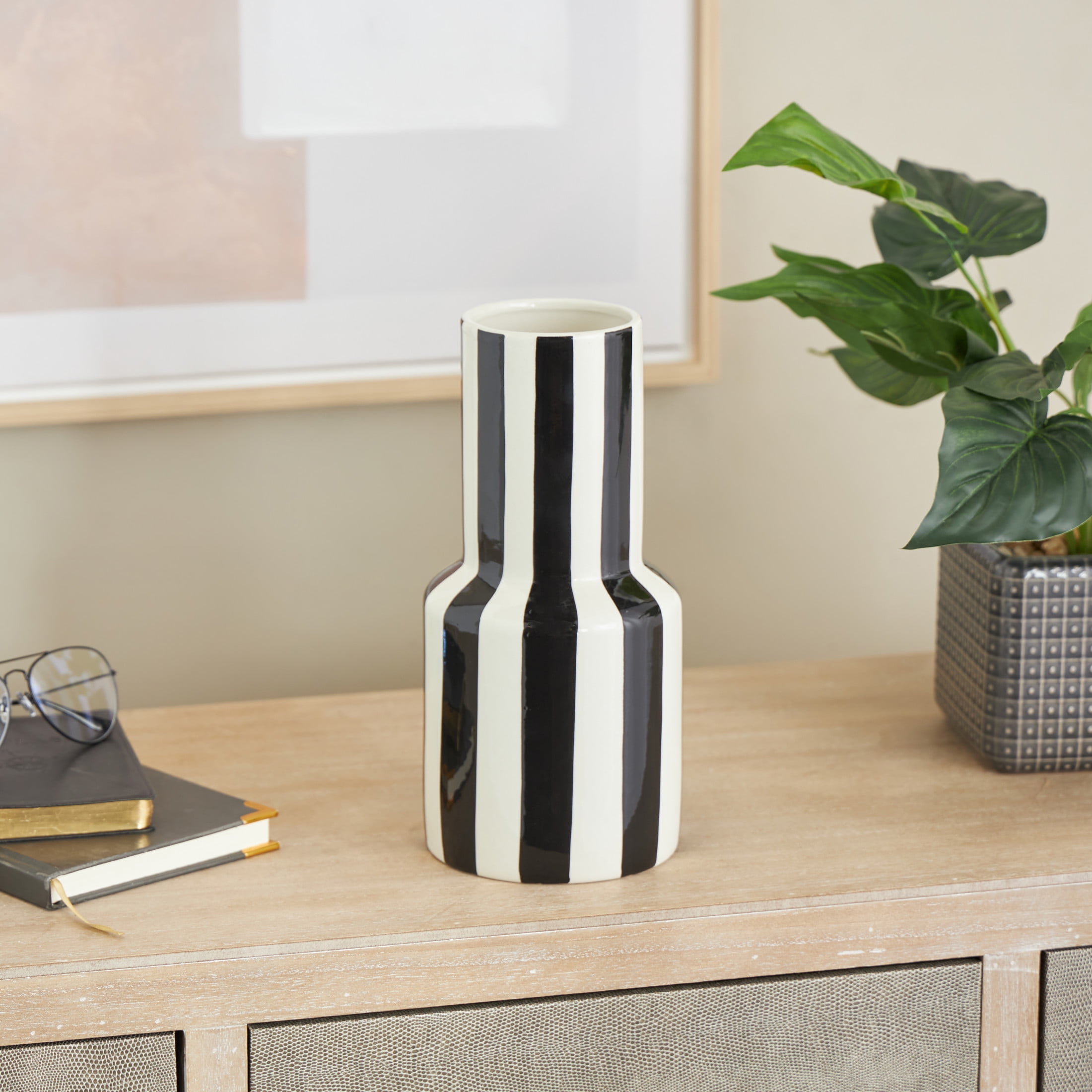 DecMode 11" Round Black Ceramic Vase with White Vertical Stripes
