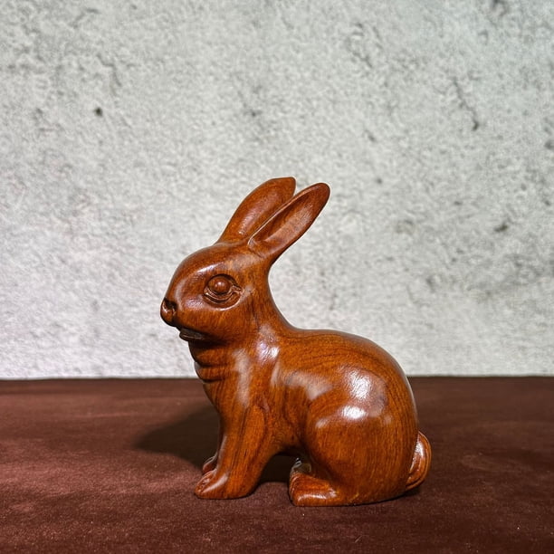 Ebony wood carved rabbit figurine, a wooden animal zodiac rabbit decoration for home living room and entryway.