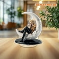 thumbnail image 5 of Revolving acrylic ornament featuring Rod Stewart on a half-moon beside a gift box, mounted on a glossy black oval base with a white background, 5 of 7