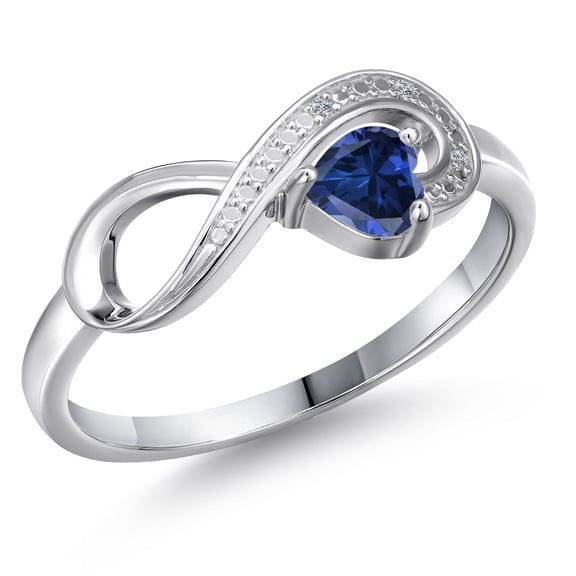 Gem Stone King 10K White Gold Blue Created Sapphire and White Diamond Accent Infinity Ring for Women (0.51 Cttw, Heart Shape 4MM, Gemstone September Birthstone, Size 7)
