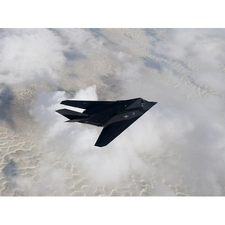 An F-117 Nighthawk Stealth Fighter in Flight Over New Mexico Print Wall Art By Stocktrek Images