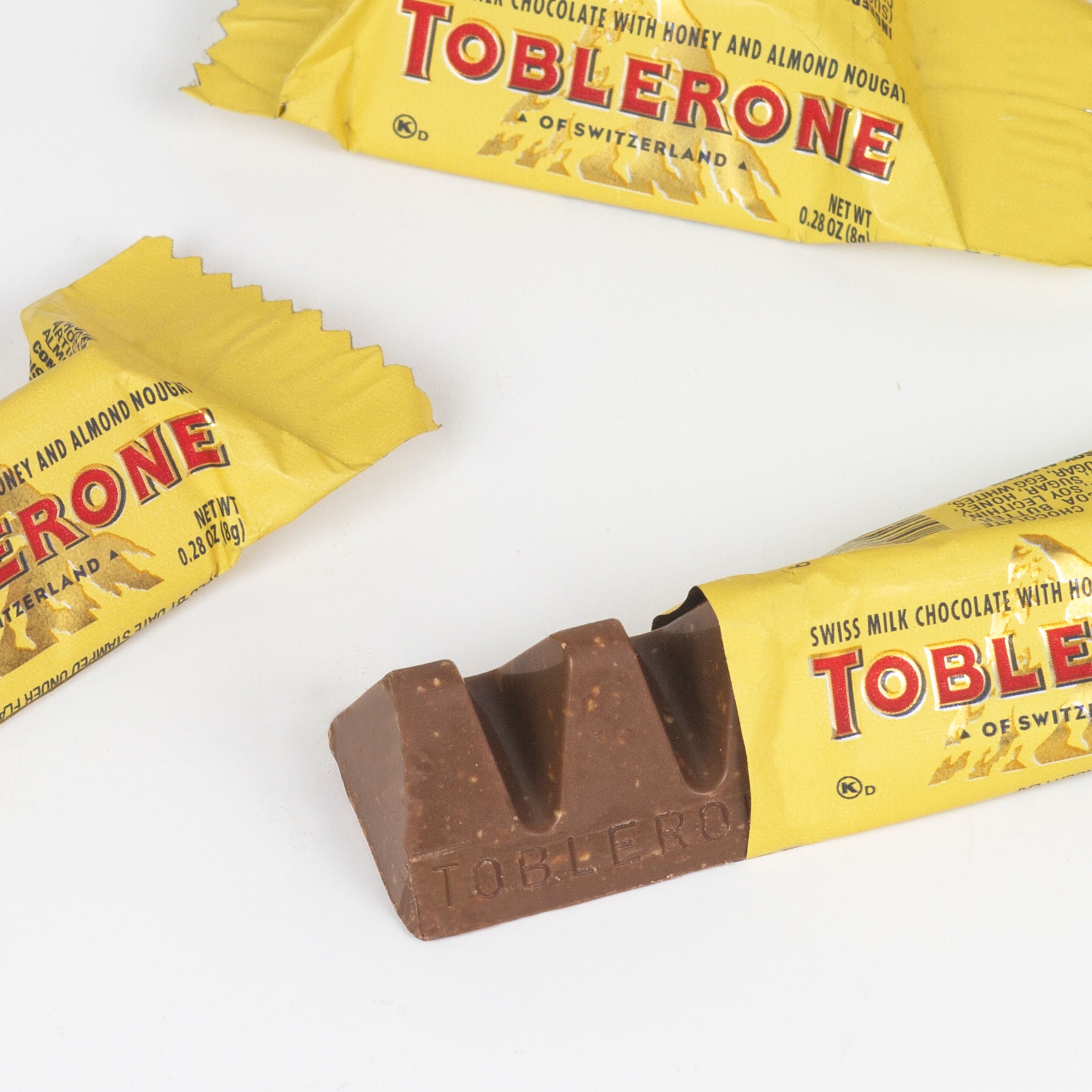 Toblerone Tiny Swiss Milk Chocolate Candy Bars with Honey and Almond  Nougat, 7.05 oz Bag 