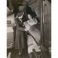 thumbnail image 2 of American Airlines Stewardess With A Passenger In A Sleeping Berth On A Commercial Flight In The 1930S. American Airlines, 2 of 2