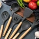thumbnail image 3 of Juego de utensilios de cocina, utensilios de cocina de silicona antiadherentes resistentes al calor con mango de madera, 12 piezas, incluye cucharas, pinzas, batidor, espátula, 3 of 5