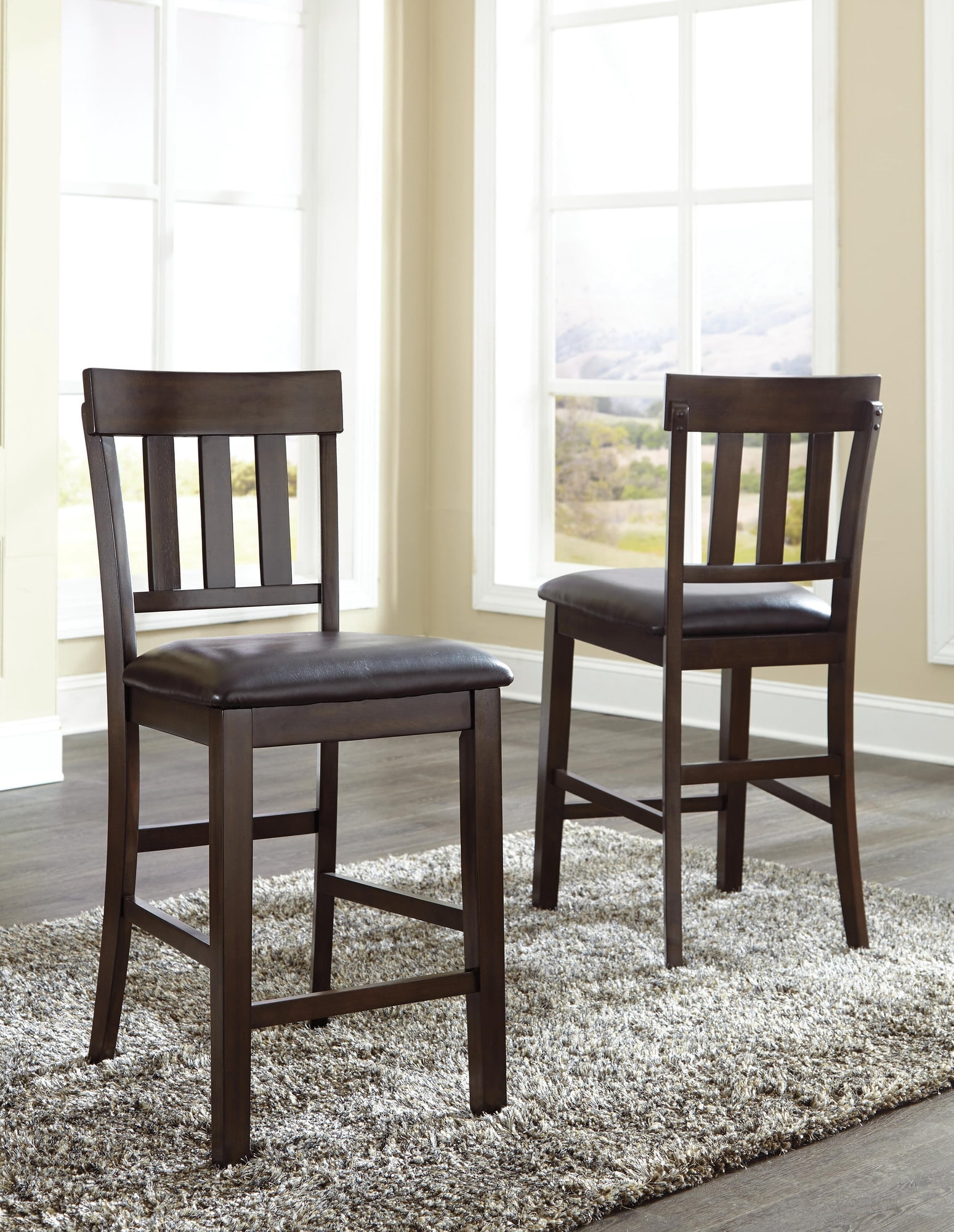 Signature Design by Ashley Haddigan Upholstered Bar Stool Set (2), Dark Brown, Counter Height Chairs with Faux Leather Seat and Wood Frame