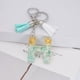 thumbnail image 2 of Llavero de letras con borlas verdes | Colgante de cristal acrílico | Lámina de oro, pegamento en gota, joyería de piedra engrosada | Amuleto de bolso con estilo, accesorio para mochila | 1 pieza, 2 of 2