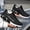 Black, variant on Lightweight Breathable Sneakers for Men Featuring a Geometric Black And White Design, Ideal for Running, Walking, And Training. They Come with a Lace-Up Closure, MD Sole, And Fabric Upper