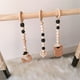 thumbnail image 1 of Fiudx Gimnasio de Madera para Bebés, Juego de Juguetes Colgantes Suaves, Desarrollo Sensorial para Recién Nacidos, Marco de Madera con Adornos de Cuentas, Regalo Ideal para Niños y Niñas, Tamaño de 2, 1 of 2