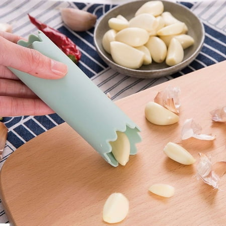 

Silicone garlic peeler with sealed bottom kitchen manual multifunctional tool garlic peeler and garlic press.