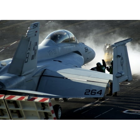 Canvas Print A U.S. Navy F/A-18 Super Hornet aircraft is prepared for a catapult launch from the aircraft carrier Stretched Canvas 10 x