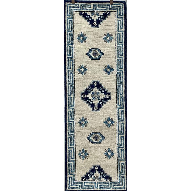homeroots home decor 396075 2’ x 7’ Blue and Cream Bordered Runner Rug