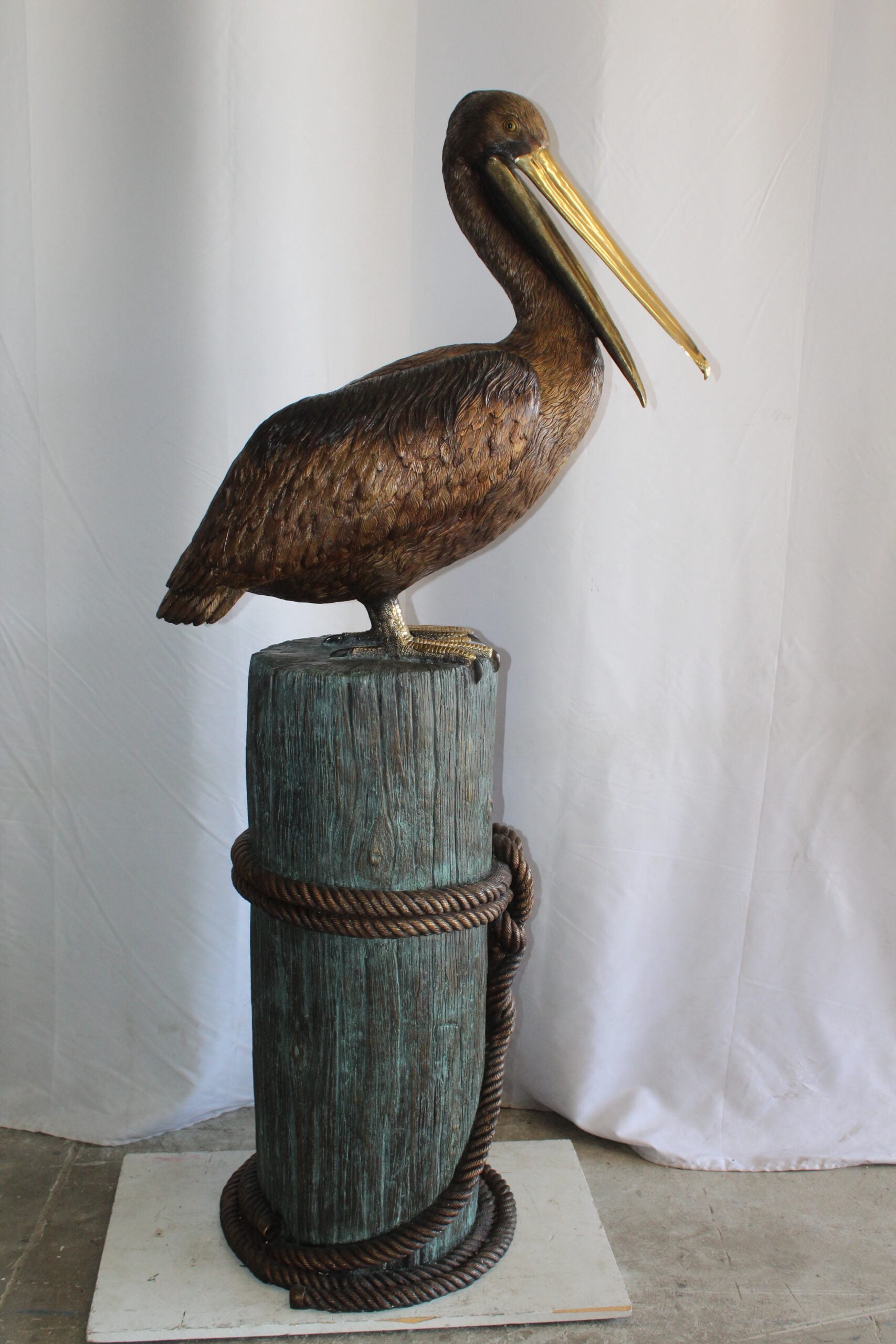 Nifao Pelican Outdoor Fountain Statue Mounted on Tree Stump, Lifesize Bronze Garden Water Feature for Patio & Yard – Garden Outdoor Decor Sculpture, 33"L x 23"W x 73"H