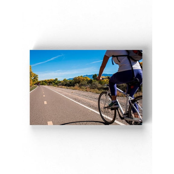 Riding A Bike On The Road Wrapped Canvas  -Image by Shutterstock,
