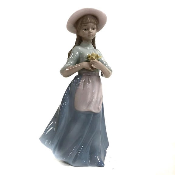 Farm Girl Holding A Flower Figurine