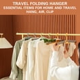 thumbnail image 3 of Percha de ropa plegable portátil - Organizador de viajes y hogar multiusos - Agarre a prueba de viento - Diseño que ahorra espacio - Plástico duradero - Ideal para ropa, accesorios, pañales - 1, 3 of 7