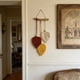 thumbnail image 5 of Adorno de pared bohemio de macramé con forma de hoja y varilla de madera – Decoración de pared con borla tejida a mano para dormitorio, sala de estar y habitación infantil., 5 of 6