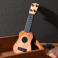 thumbnail image 3 of Ukelele en miniatura de plástico, modelo de guitarra, instrumento musical, ukelele simulado., 3 of 6
