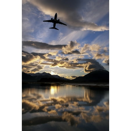 Alaska Airlines jet takes off from Juneau International airport at dawn Juneau Alaska PosterPrint