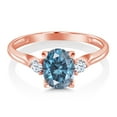 thumbnail image 3 of Gem Stone King 10K Rose Gold Oval Persian Blue Moissanite and White Created Sapphire Engagement Ring for Women (1.48 Cttw, Oval 8X6MM and Round 2.5MM , Available in Size 5, 6, 7, 8, 9), 3 of 6