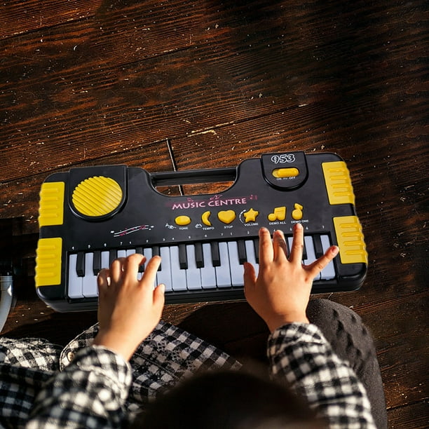 Teclado Piano Electrónico 31 Teclas | Instrumento musical portátil | Diseño de plástico ligero | Aprendizaje interactivo y creatividad | Ritmos de 2 tonos | Amarillo | 12x6.1x1.37in | Alimentado por