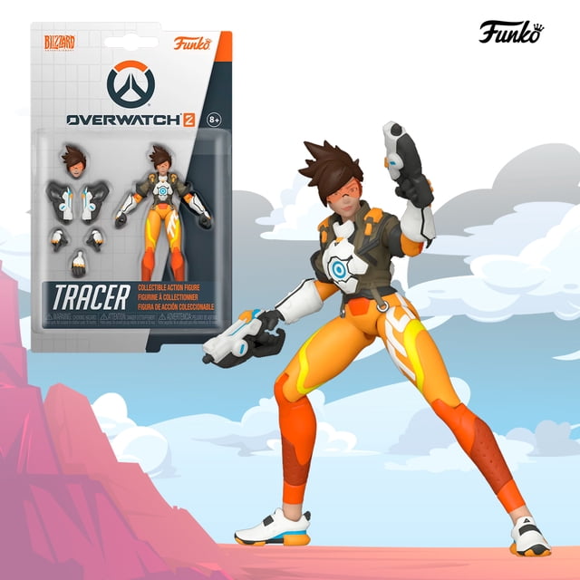 figura de accion funko tracer overwatch 2 original videojuego Coleccionable Funko de Tracer en vista 3/4 con pistolas duales y traje naranja y blanco con detalles azules, incluye cabezas y manos intercambiables en blister sellado y caja protegida con plástico burbuja; suele usarse para exhibir en vitrinas de coleccionistas.