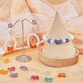 thumbnail image 4 of 1 caja de 100 cuentas de vidrio con forma de lazo, coloridas, transparentes, aleatorias, con forma de mariposa, con agujeros horizontales, cuentas espaciadoras sueltas., 4 of 6