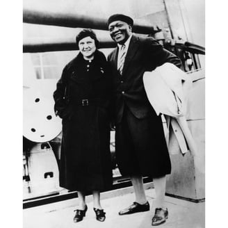 This image features the famous boxer Jack Johnson with Little, a nickname for his sparring