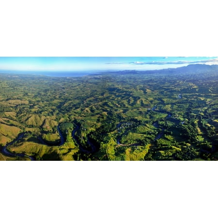 The Nadi River winds through the valleys forests and villages with the Sleeping Giant mountains and Nadi coastal town in the background as seen from 2000 feet high on an Adrenalin Fiji balloon