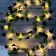 thumbnail image 1 of Guirnalda de luces artificiales de 2 m con hojas verdes y 20 LED, ideal para jardín, patio, casa, boda, etc., 1 of 5