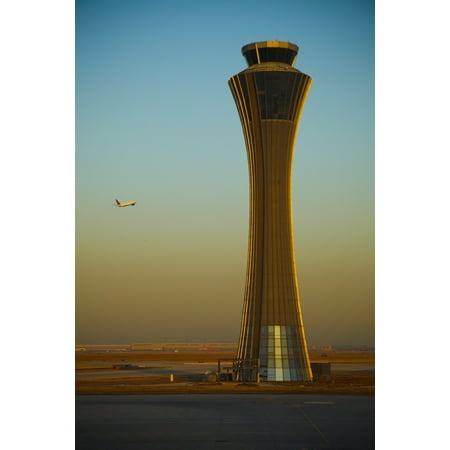 An Airplane Flies Past The Air Traffic Control Tower At The Beijing Airport Beijing China Stretched Canvas - Blake Kent  Design Pics (12 x
