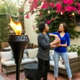 thumbnail image 2 of TIKI Brand 65-in Metal Outdoor Torch, Weather-Resistant Large Flame Torch for Patio & Backyard with Easy-Pour Canister, 2 of 6