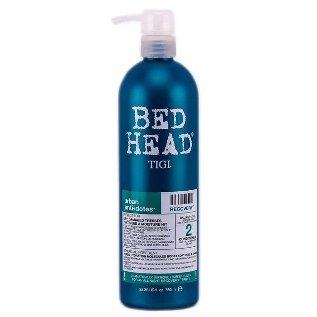 acondicionador tigi bed head urban antidotes recovery 750 ml, botella alta azul turquesa con dispensador; vista frontal centrada mostrando el logo blanco "BED HEAD", etiqueta que indica "Recovery" y el tamaño 25 onzas (750 ml). Formato grande ideal para uso frecuente; también suele usarse como acondicionador de preparación antes del secado.