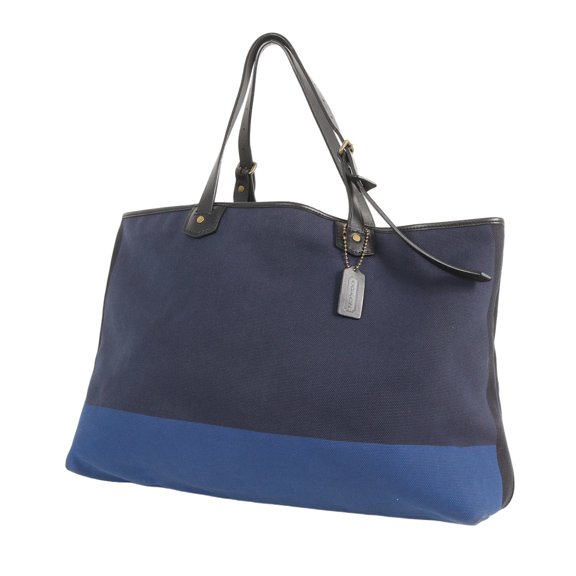 Pre-Owned COACH Bleecker Colorblock Canvas Holdall Tote Bag (Blue & Navy Two-Tone Canvas) -...