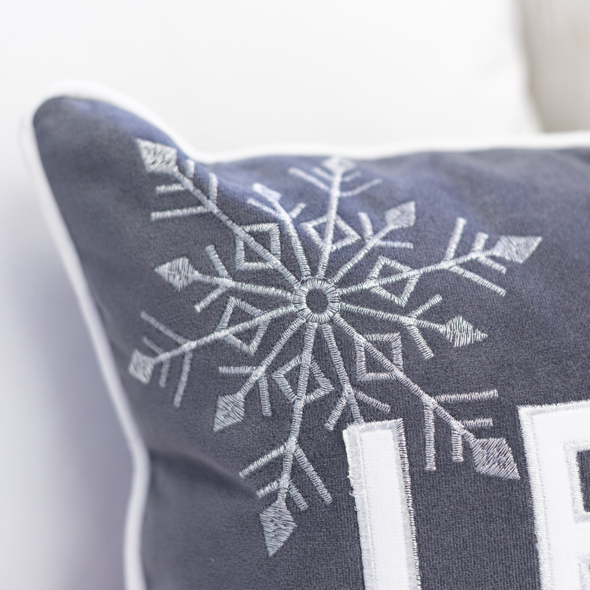 Let-It-Snow Gray and White Embroidered Snowflake Graphic Polyester 14 in. x 20 in. Decorative Throw Pillow