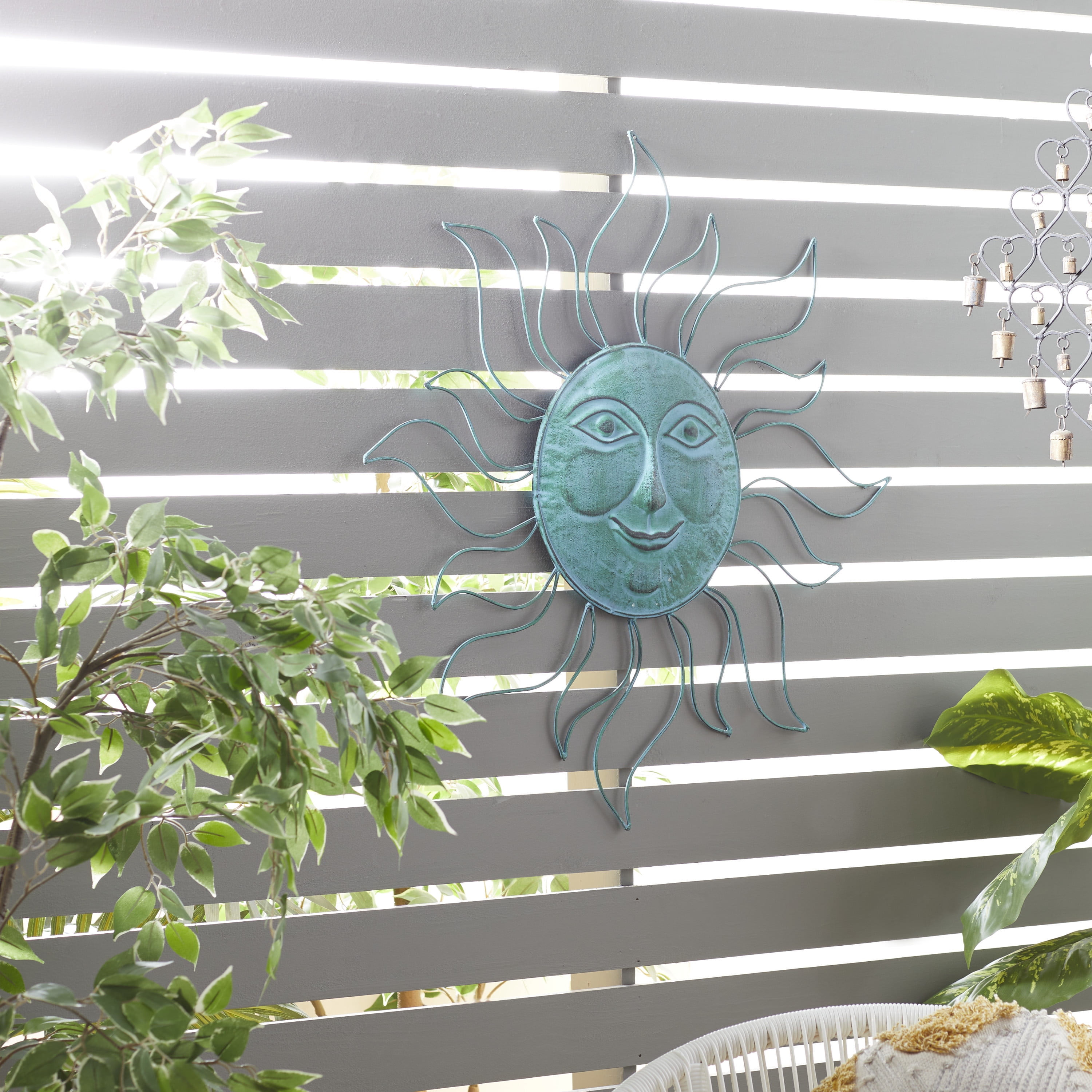 The Novogratz Teal Metal Indoor Outdoor Sun Wall Decor with Wire Frame
