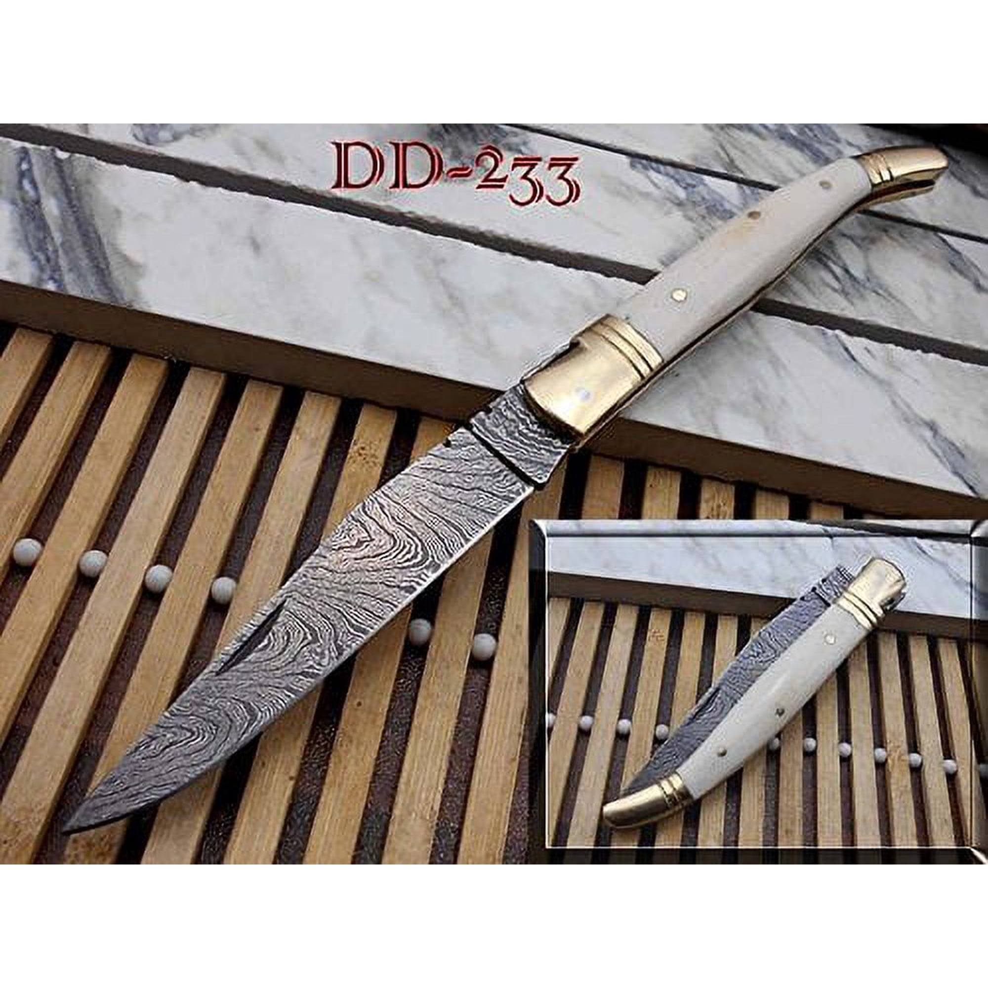 White Laguiole Folding Damascus steel knife. hand forged custom twist pattern 4.1 Blade. Natural camel Bone & brass bolster scale. Cow hide leather sheath Included