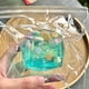 thumbnail image 4 of Juguete antiestrés de goma azul con lentejuelas de estrellas y conchas | Juguete antiestrés de 4,5 cm para apretar y descomprimir | Adorno curativo de escritorio y regalo para desahogarse, 4 of 5