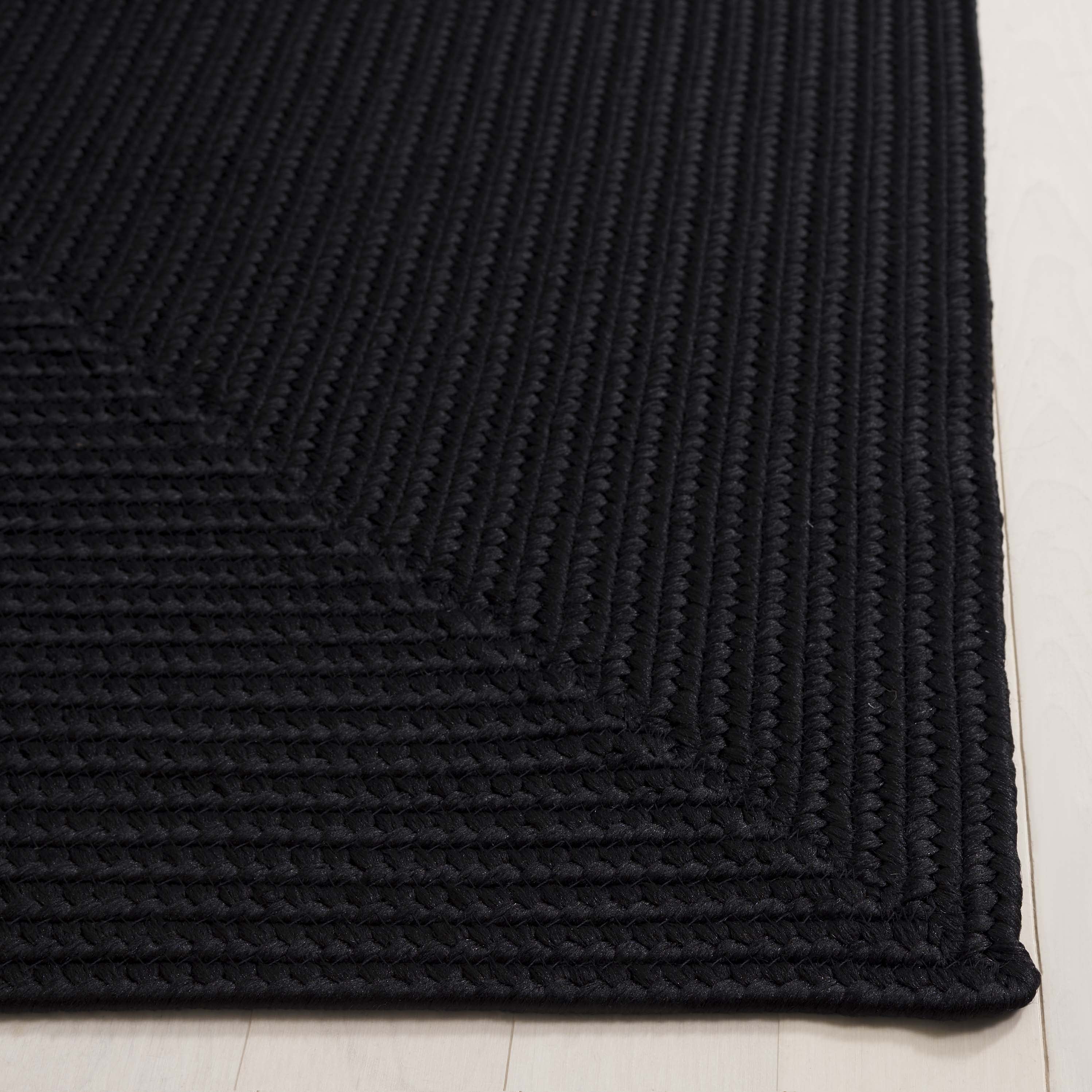 SAFAVIEH Braided Rishika Solid Machine Washable Reversible Area Rug, Black, 2' x 3'