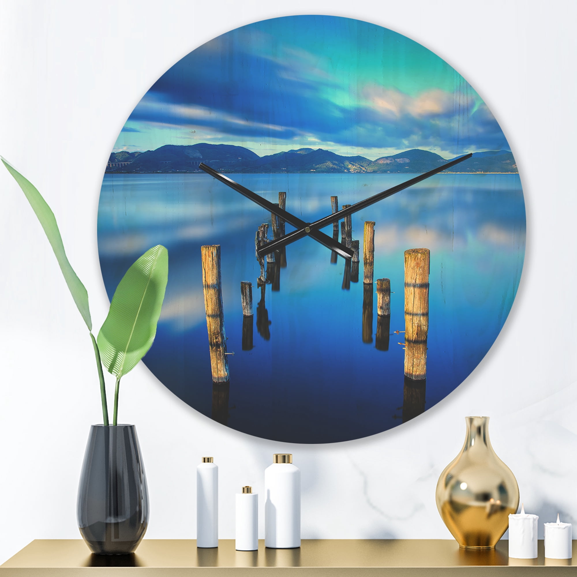 Designart 'Wooden Pier Remains in Blue Mountain Sea ' Modern Wood Wall Clock
