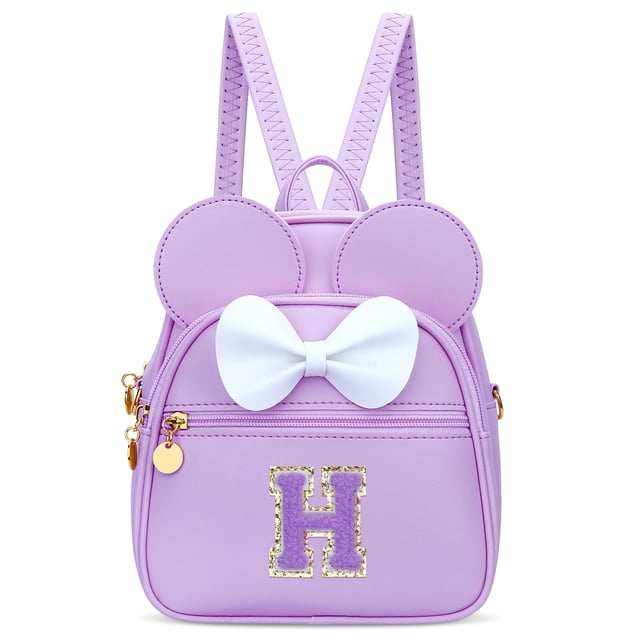 Minimochila KKXIU con iniciales en forma de lazo para niñas, piel sintética morada