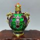 thumbnail image 1 of Antique-style snuff bottle, crafted from alloy and inlaid with moonstone, is a decorative item., 1 of 4