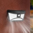 thumbnail image 3 of Lámpara de pared con proyector solar, diseño de forma redondeada, potente iluminación LED blanca con detector de movimiento, 3 of 4