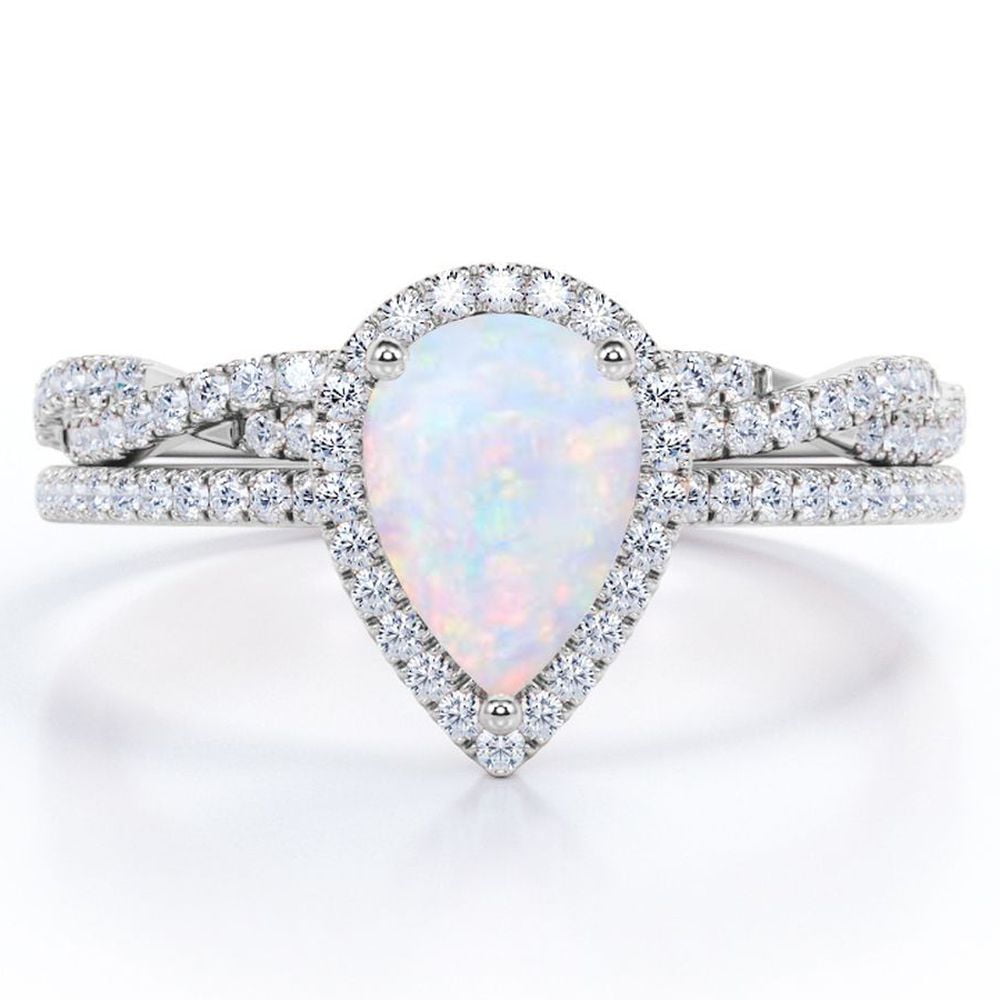 JeenMata 1.5 ct Pear Shaped Created Blue Opal and Moissanite Vintage Bridal Set - Infinity Twisted Wedding Ring Set in 18K White Gold Plating for Women