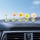thumbnail image 4 of Adorno cabezón con forma de flor para salpicadero de coche | Bonita decoración para salpicadero de coche | Colores vibrantes y movimiento de cabeceo | Material de resina ABS | Fácil de colocar en la, 4 of 6
