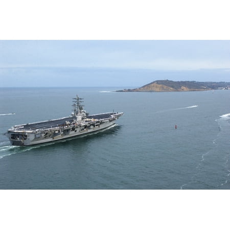 Canvas Print As Sailors man the rails, USS Ronald Reagan (CVN 76) passes by Point Loma before pulling into port. Stretched Canvas 10 x