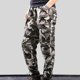 thumbnail image 1 of Puntoco Pantalones cargo de color sólido con bolsillos y cremallera, cintura elástica y largo completo para hombre, 1 of 4