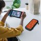 thumbnail image 3 of Bolsa de almacenamiento para la consola Switch del equipo Broncos La bolsa de almacenamiento para la consola Switch también es adecuada para auriculares, cables de carga y otros accesorios pequeños, 3 of 5