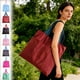 thumbnail image 1 of Bolsas De Compra De Poliéster 1 bolsa de compras reutilizable de nailon negro, plegable, impermeable, resistente y con compartimento oculto. Rkxzt, 1 of 9